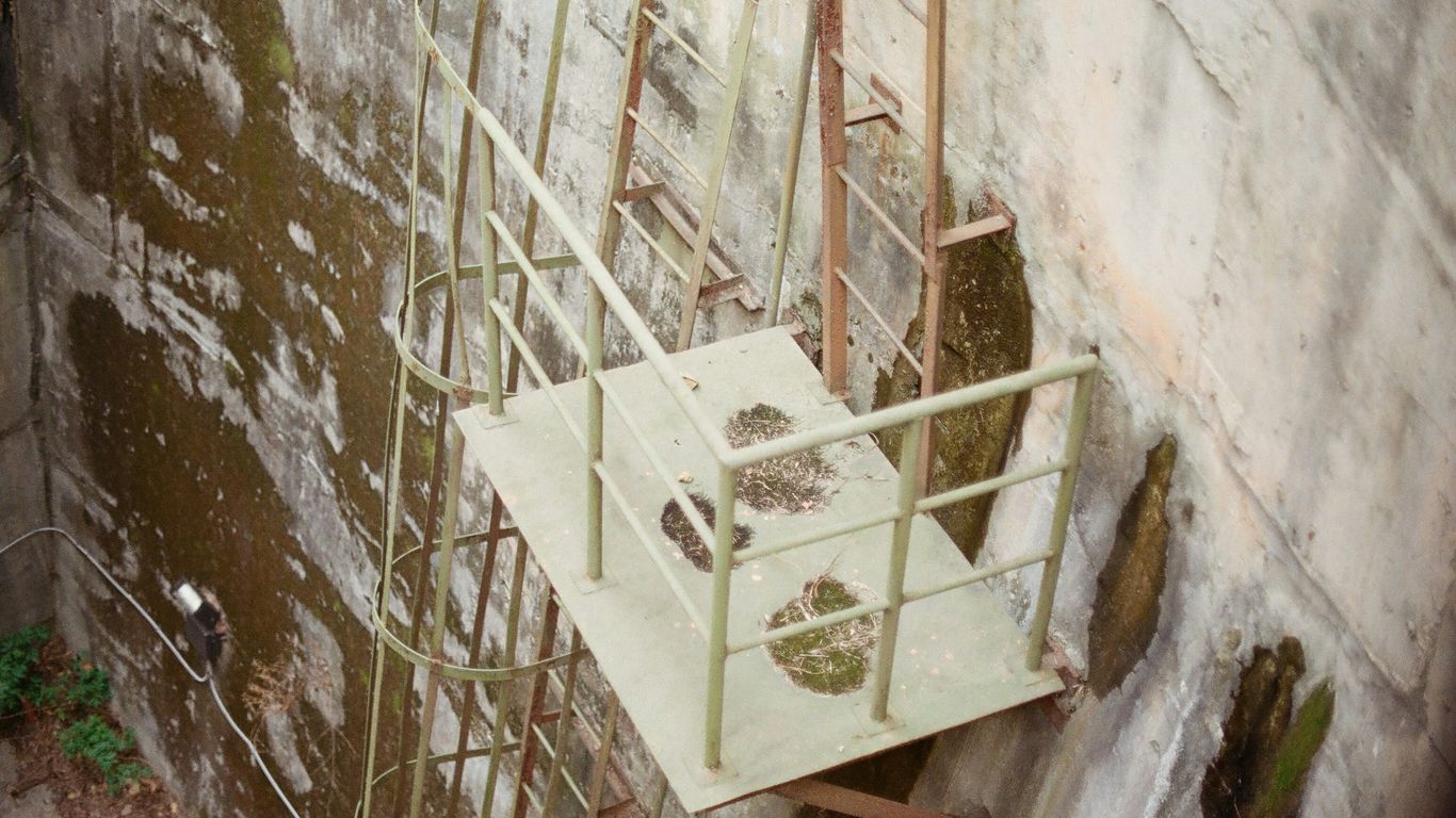 yellow metal ladder on brown sand