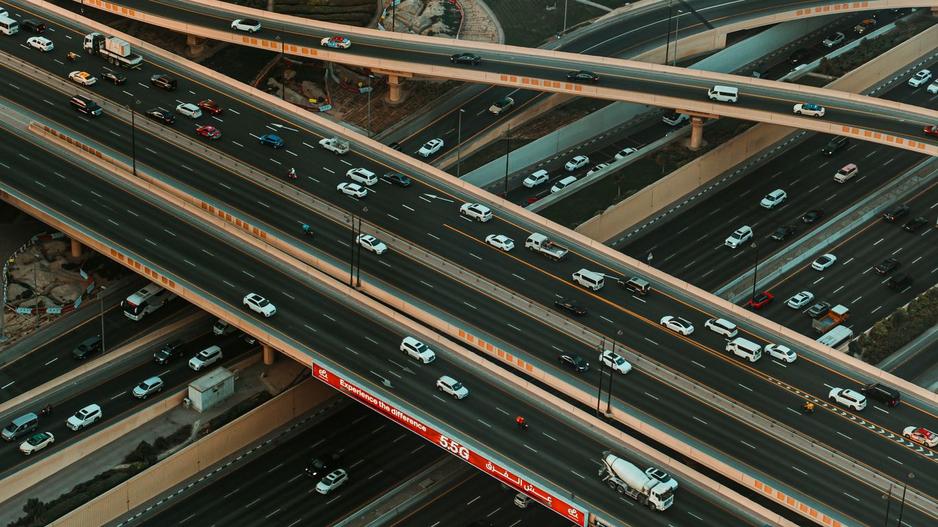 Busy highway interchange with traffic at dusk
