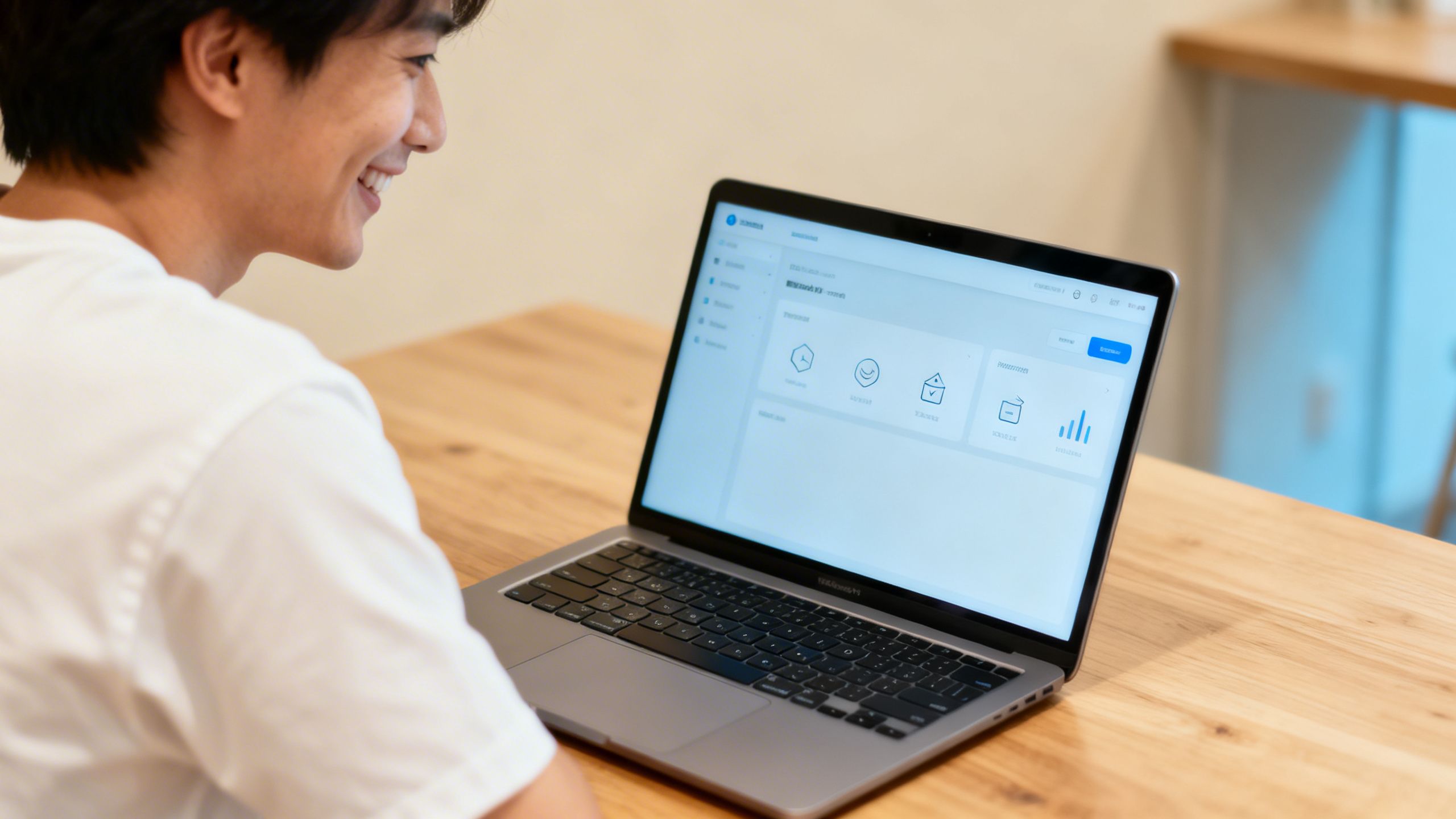 A small business owner smiling while reviewing a clean and simple dashboard on a laptop, symbolizing ease of use