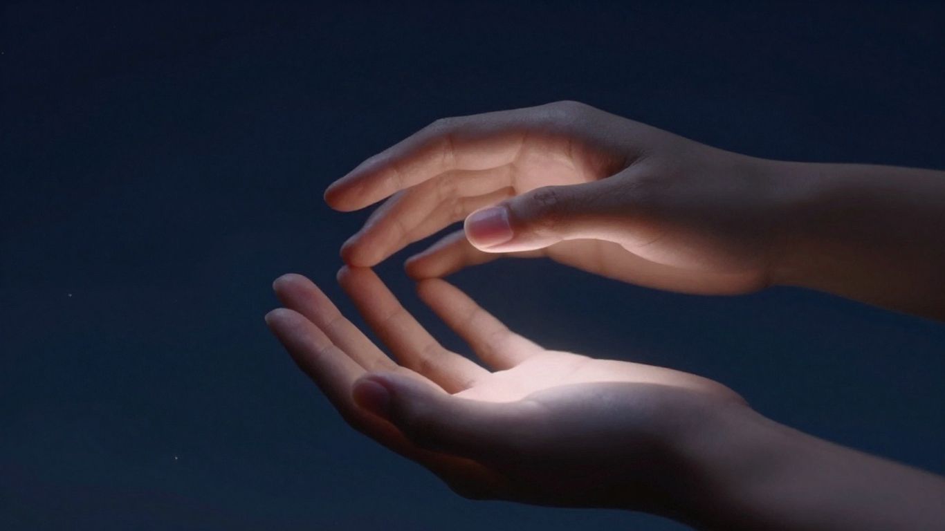 Hands touching under moonlight, cosmic connection.