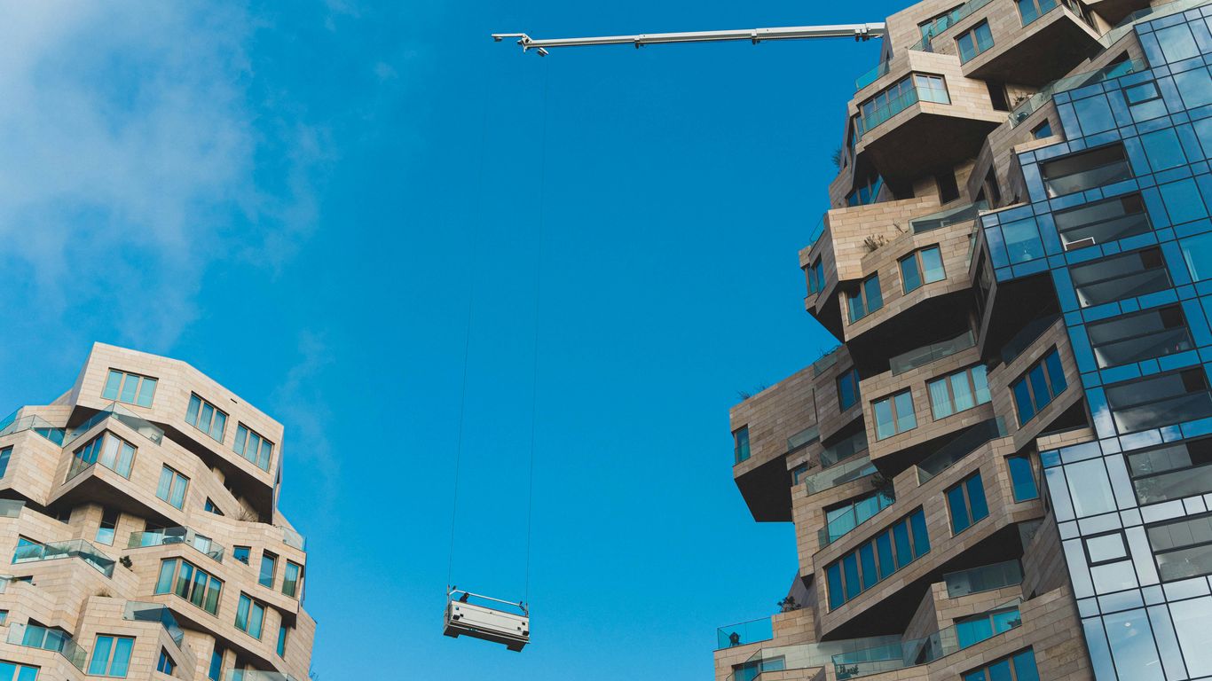 a tall building with a pole in the air