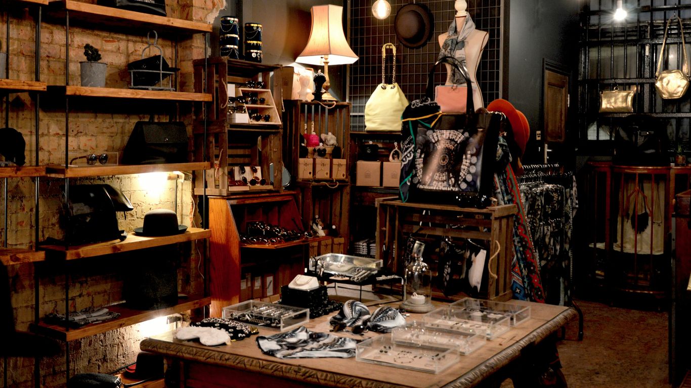 Assorted clothing items hanging in a modern boutique