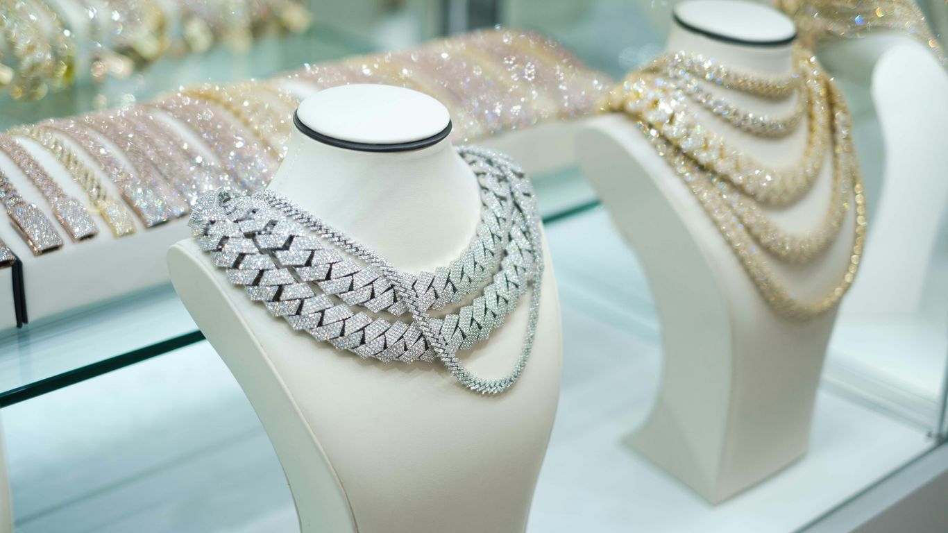 An open box turned upside down to support jewelry