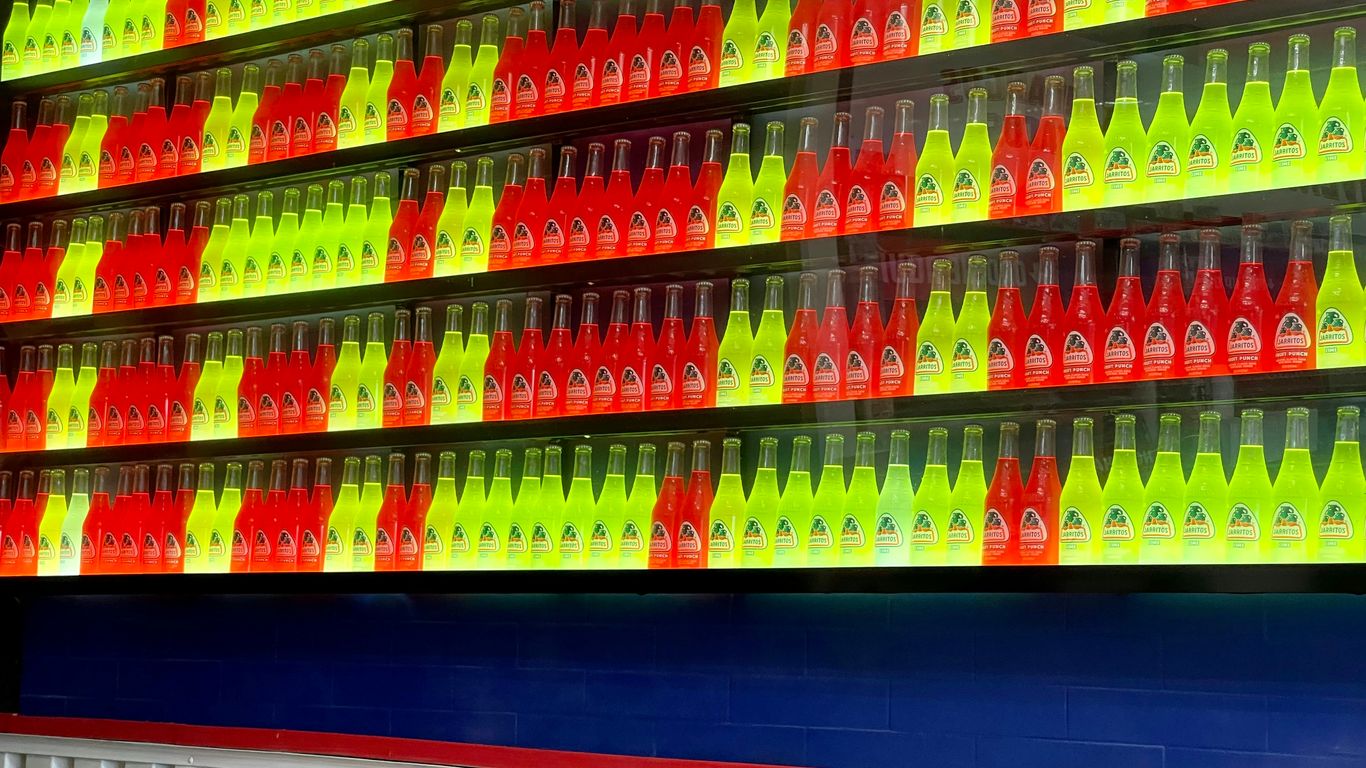 green blue red and yellow bottles on shelf