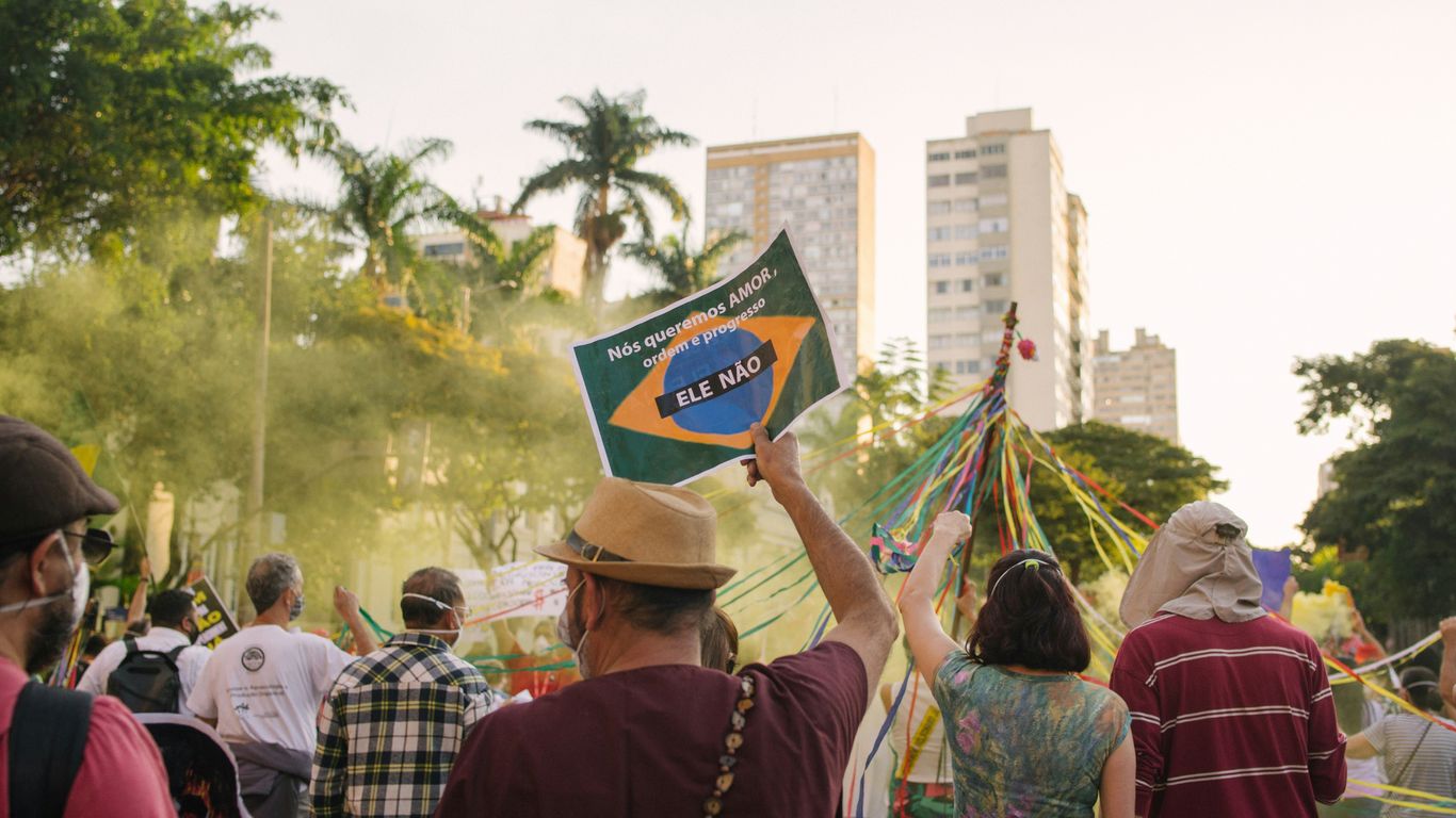 a group of people holding a flag