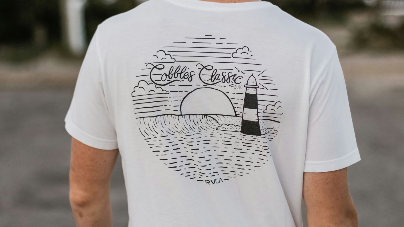 white and black t-shirt close-up photography