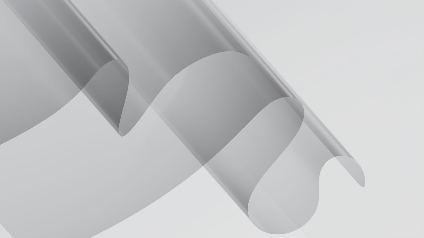 Flowing, layered shapes in shades of gray.