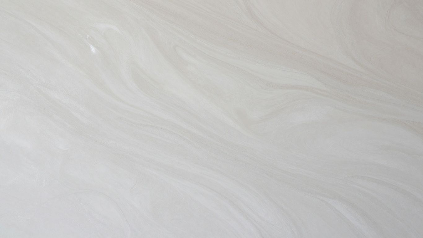 Close-up of smooth, polished Venetian plaster wall texture.