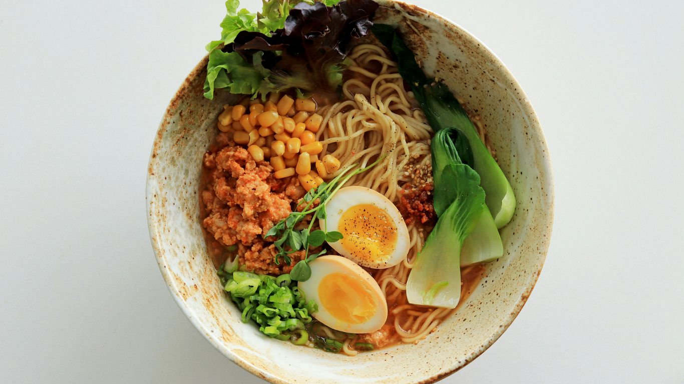A steaming bowl of traditional hawker noodles