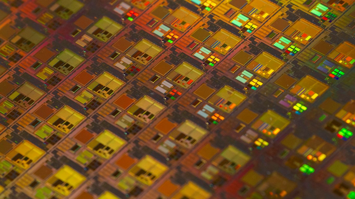 Quantum processor alongside crystal structure model