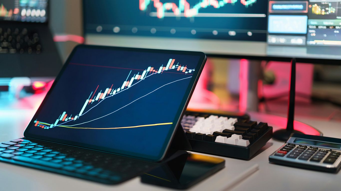 Laptop showing financial charts