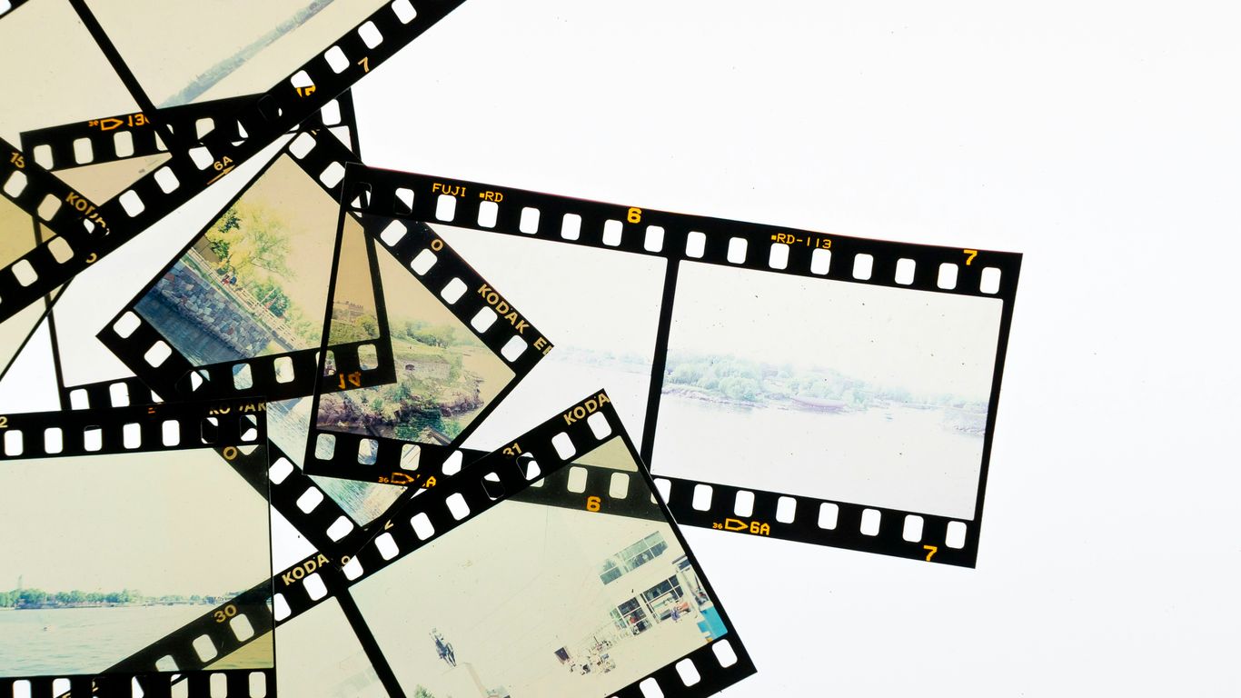 A pile of film strips with pictures on them