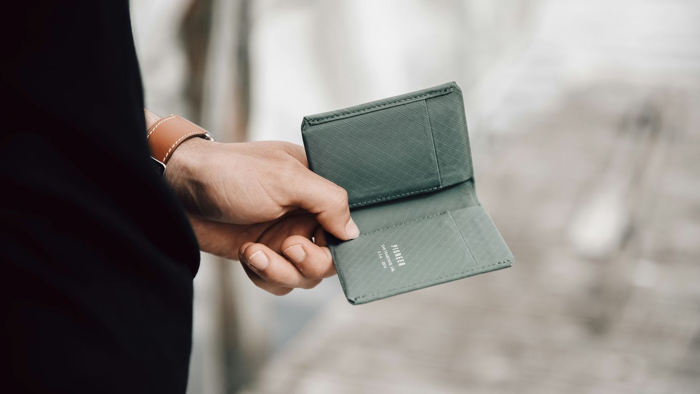 a hand holding a cell phone