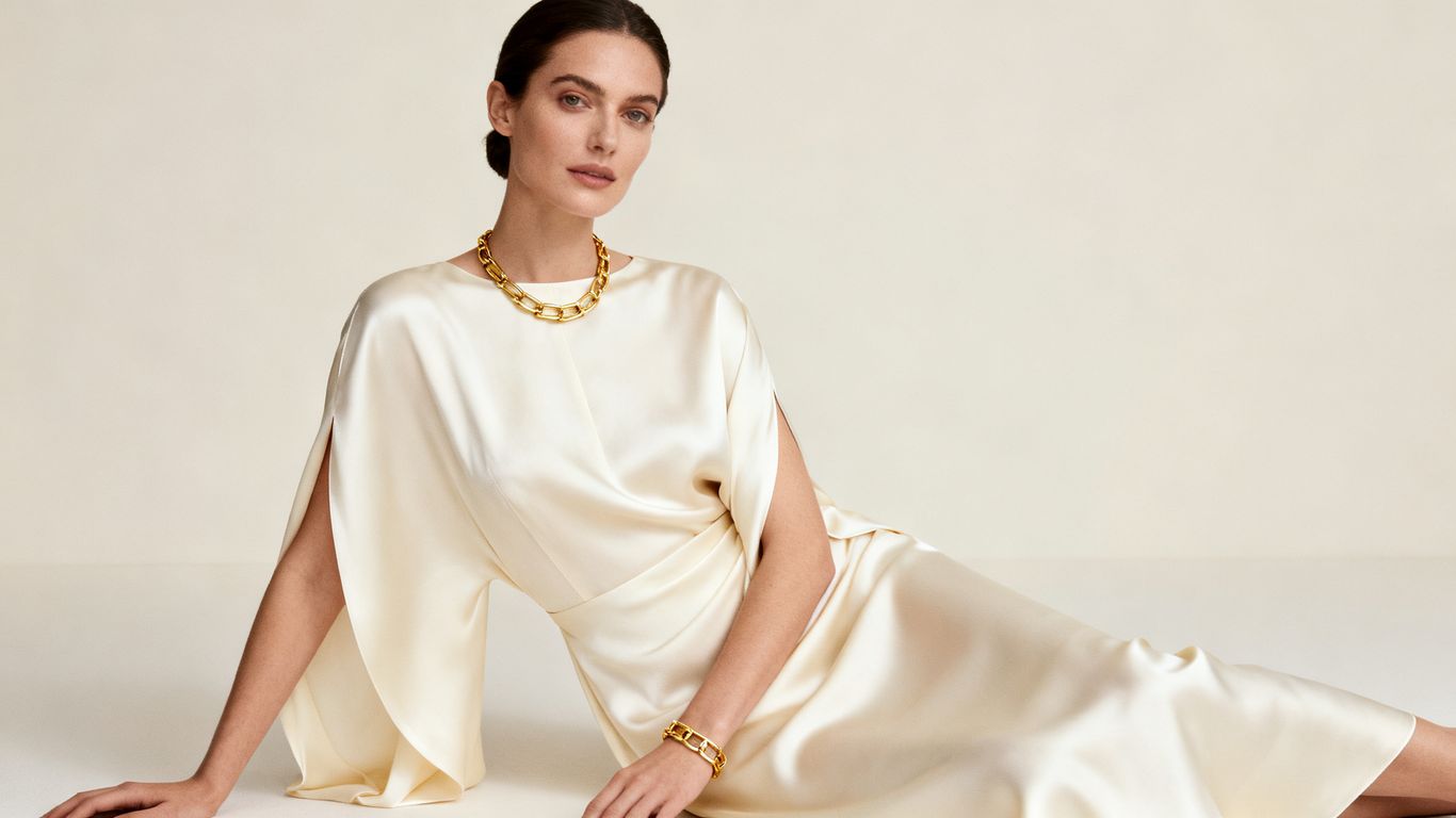Minimalist luxury fashion: elegant silk dress, neutral tones.