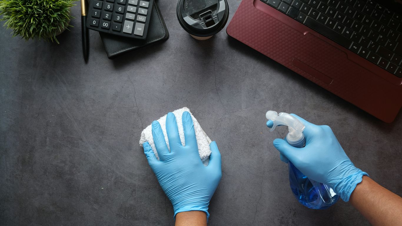 A clean polished acrylic sheet being wiped down gently