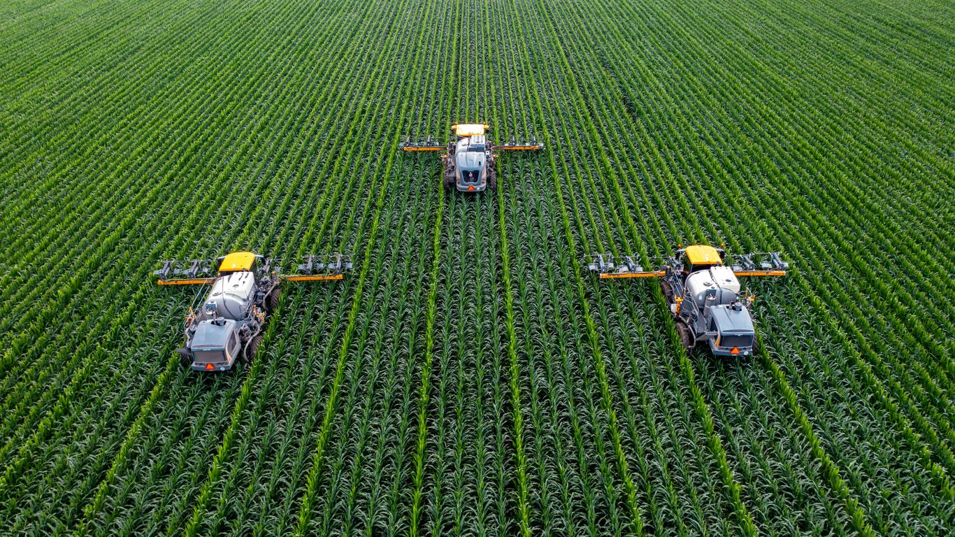 Farm logistics robot beside harvested crops