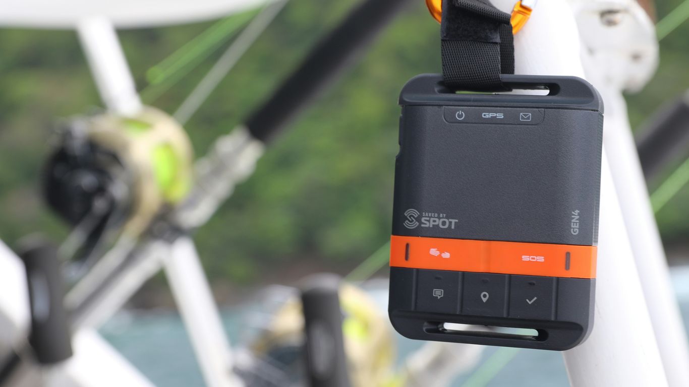 an orange and black cell phone attached to a boat