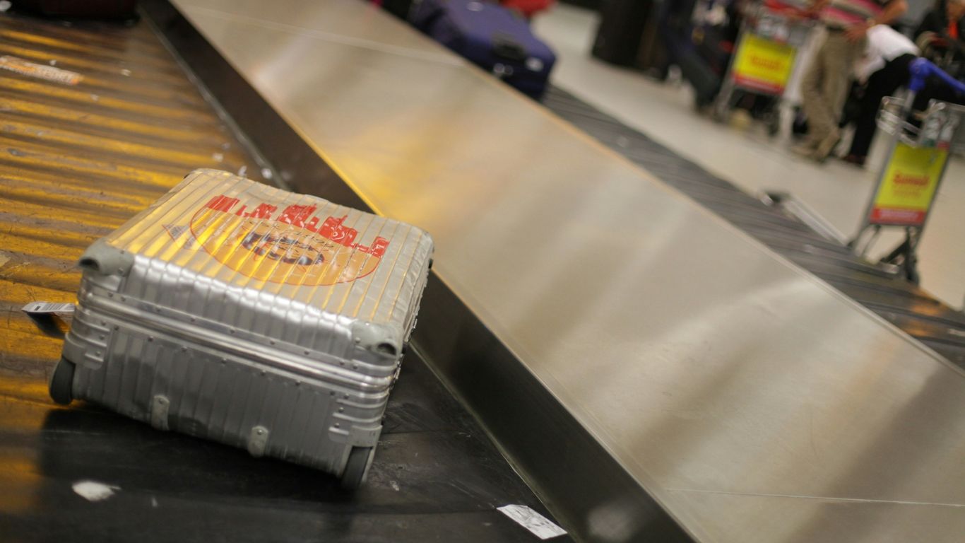 Courier carrying urgent shipment through airport