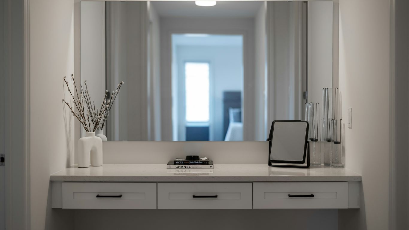 Clear boxes organized neatly on a vanity shelf