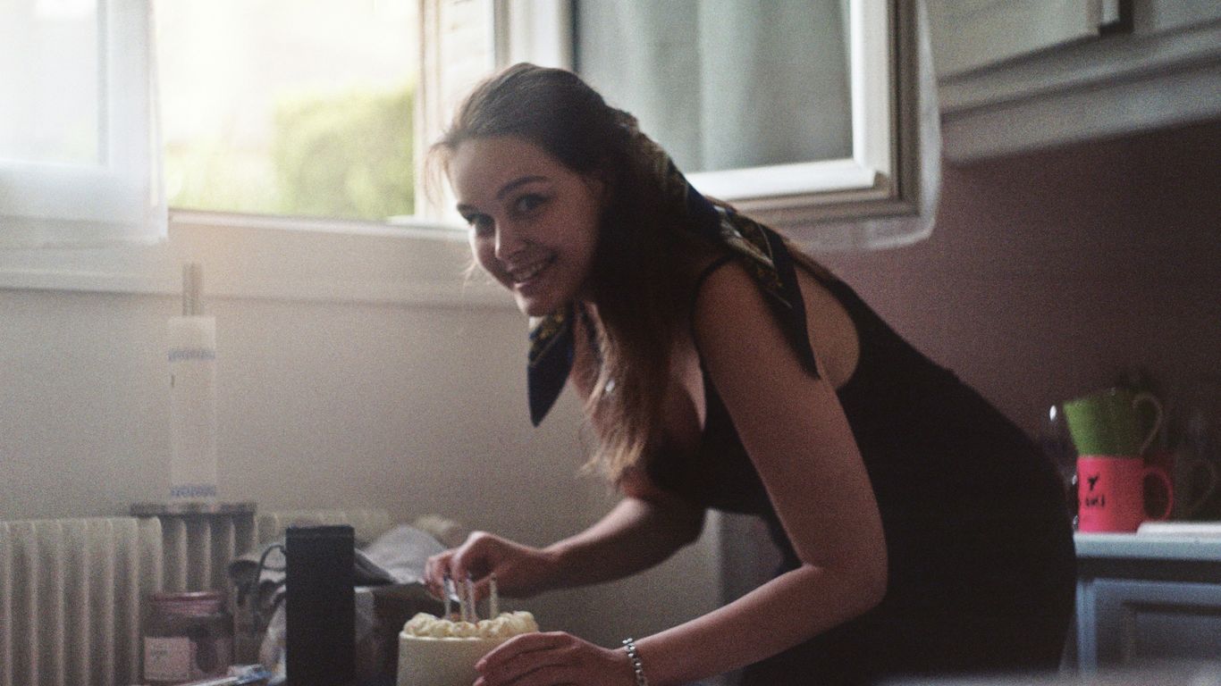 woman in black tank top sitting on chair