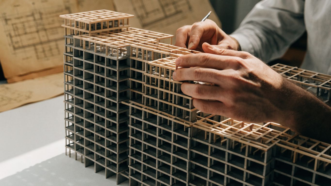 Structural engineer studying a building frame model