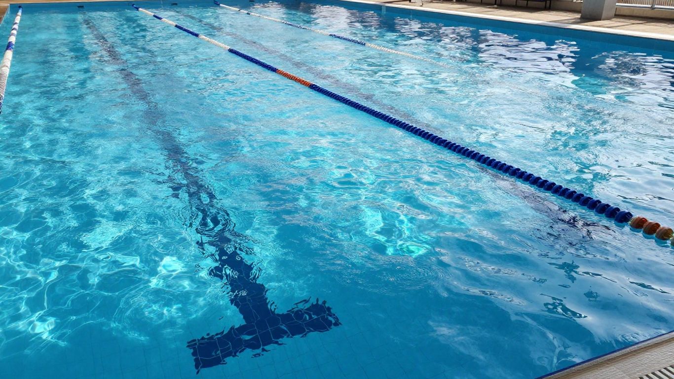 Paragon Swimming Centre main pool with blue water and lane ropes.