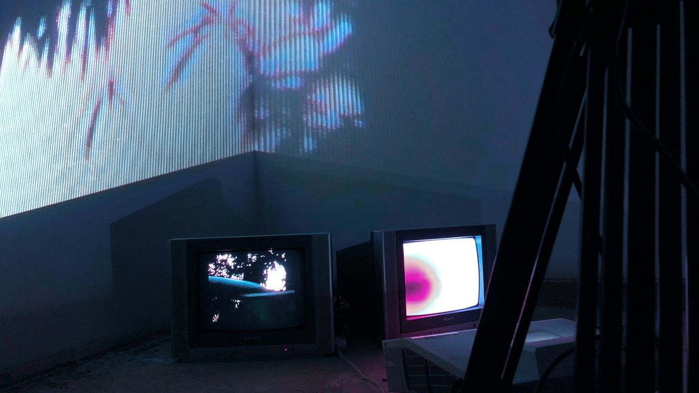 gray CRT TV turned on