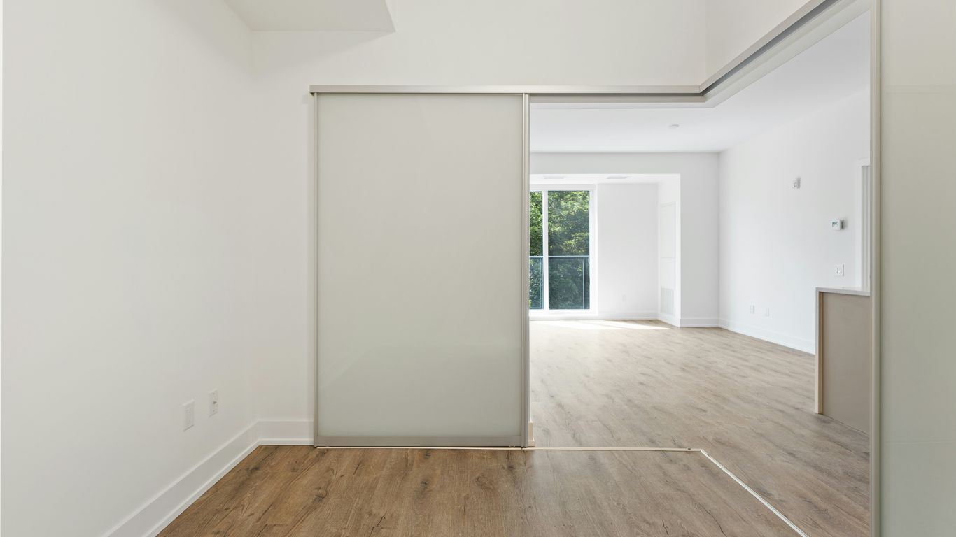 white wooden door near brown wooden parquet floor