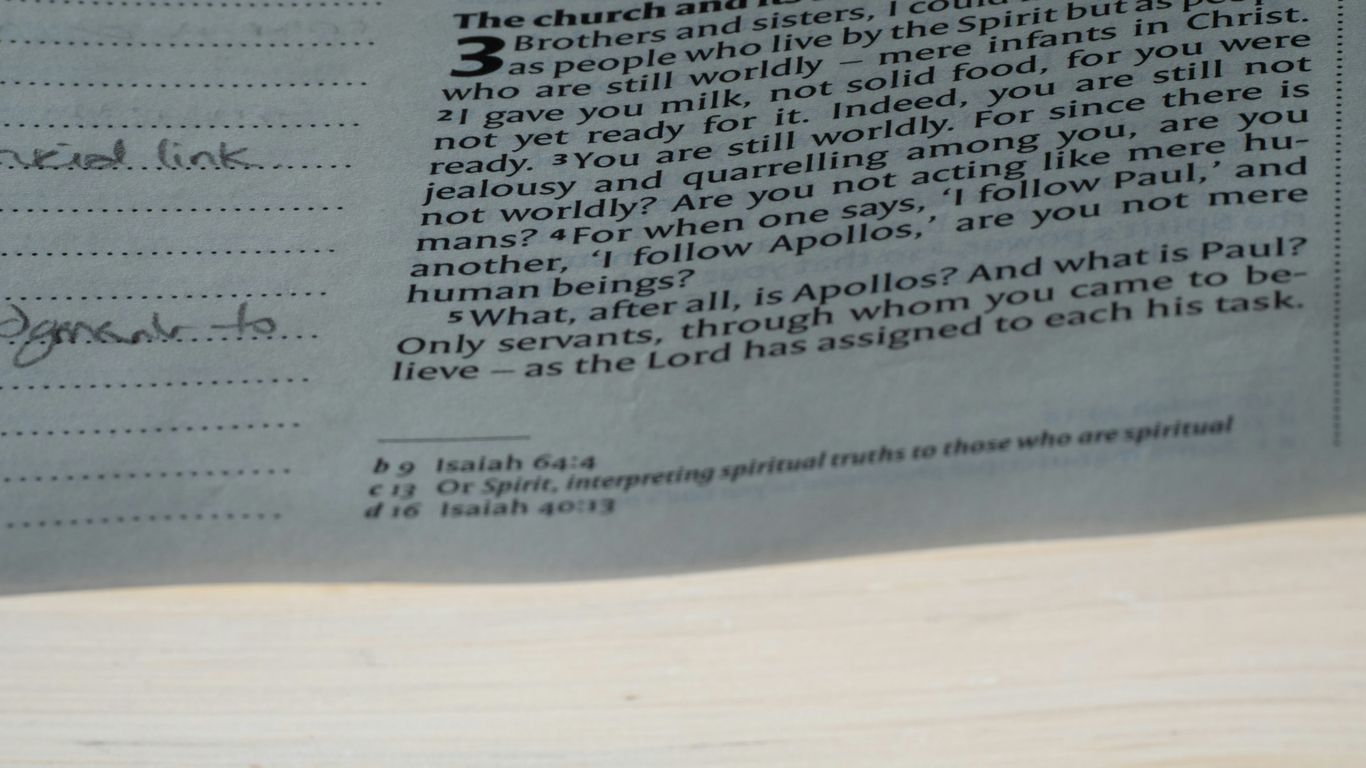 A close up of a newspaper with a clock on it