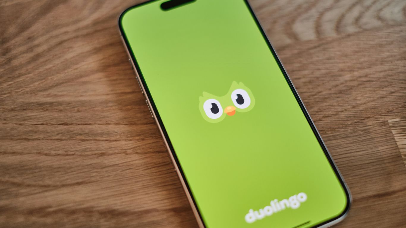 A green phone with a face drawn on it