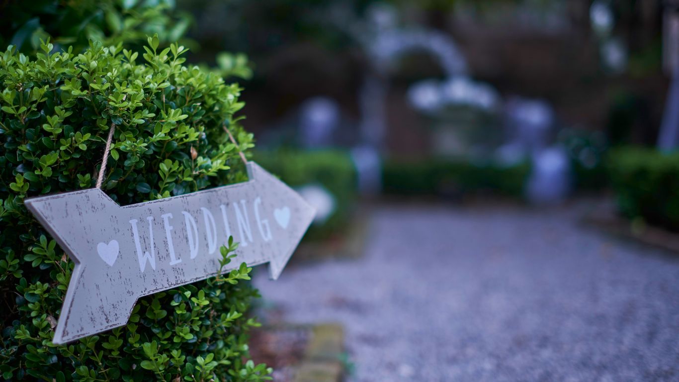 white wooden cross with kanji text