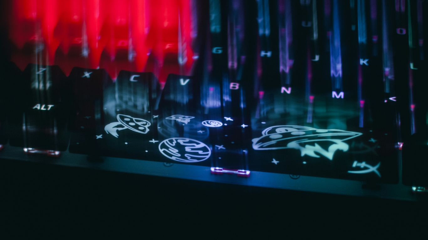 Close-up of a keyboard with colorful rgb lighting.