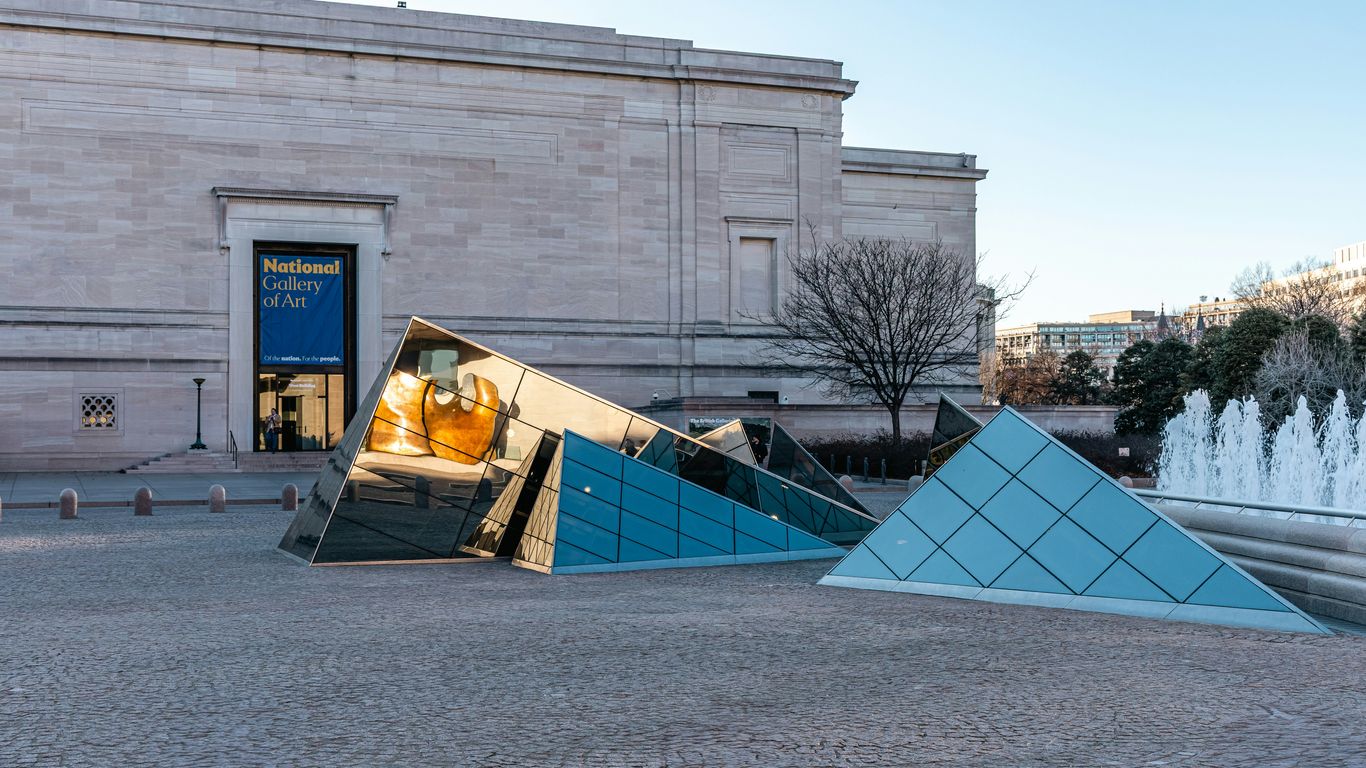 Geometric glass sculpture outside museum building