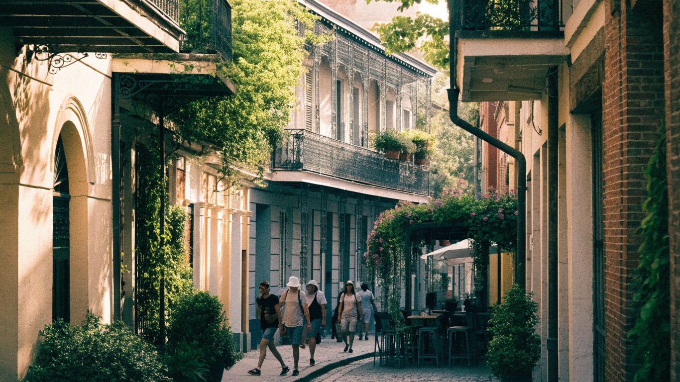 French Quarter balconies above a lively shaded street