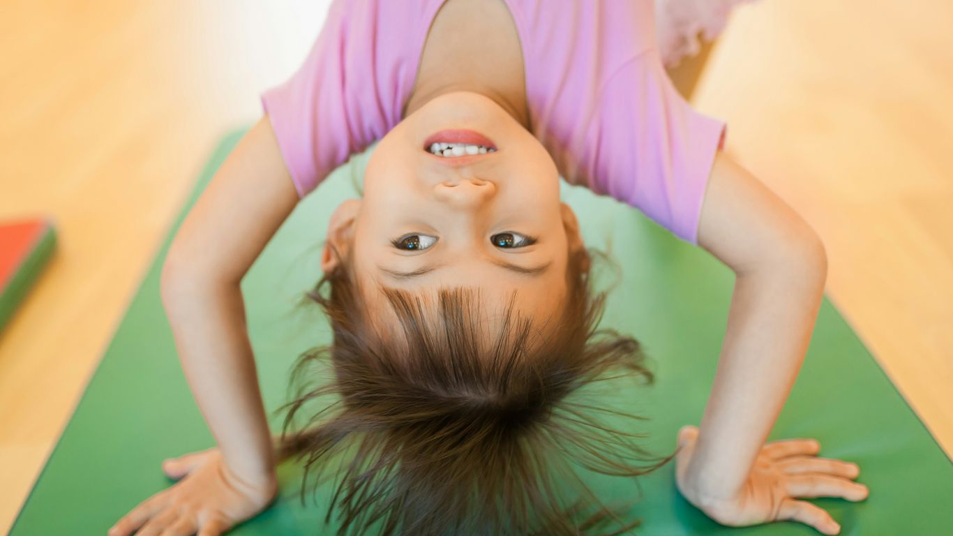 Yoga pose practice with colorful mats