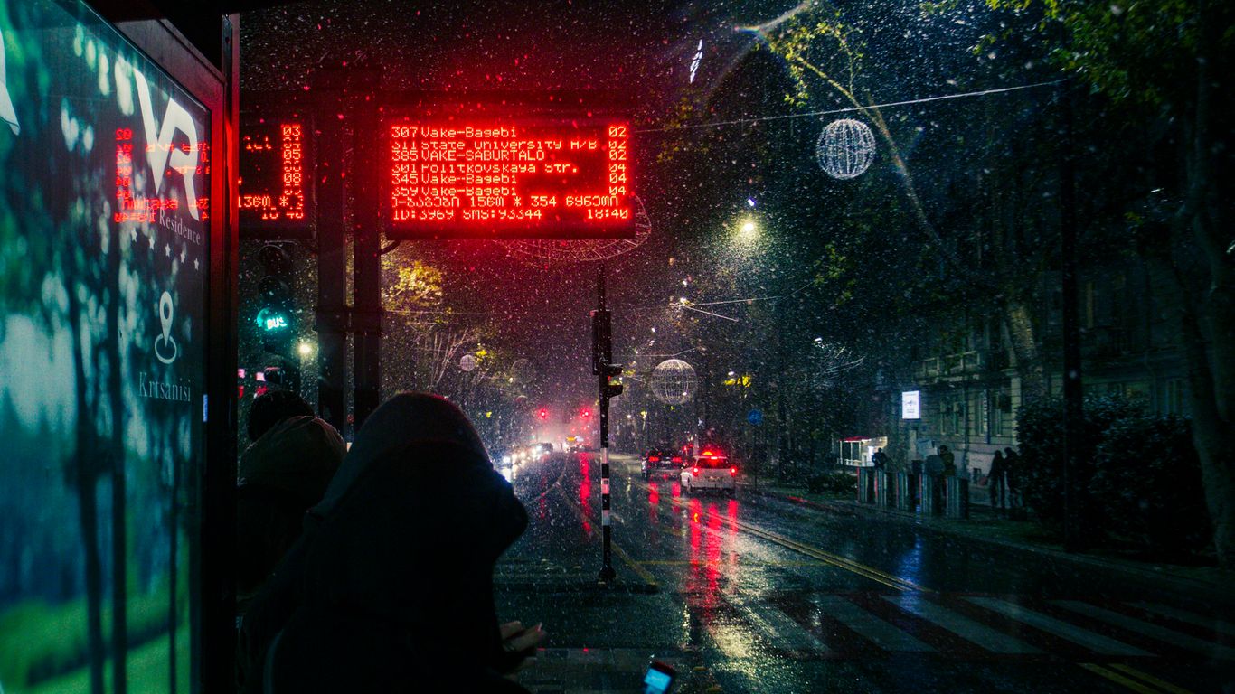 a person walking down a sidewalk