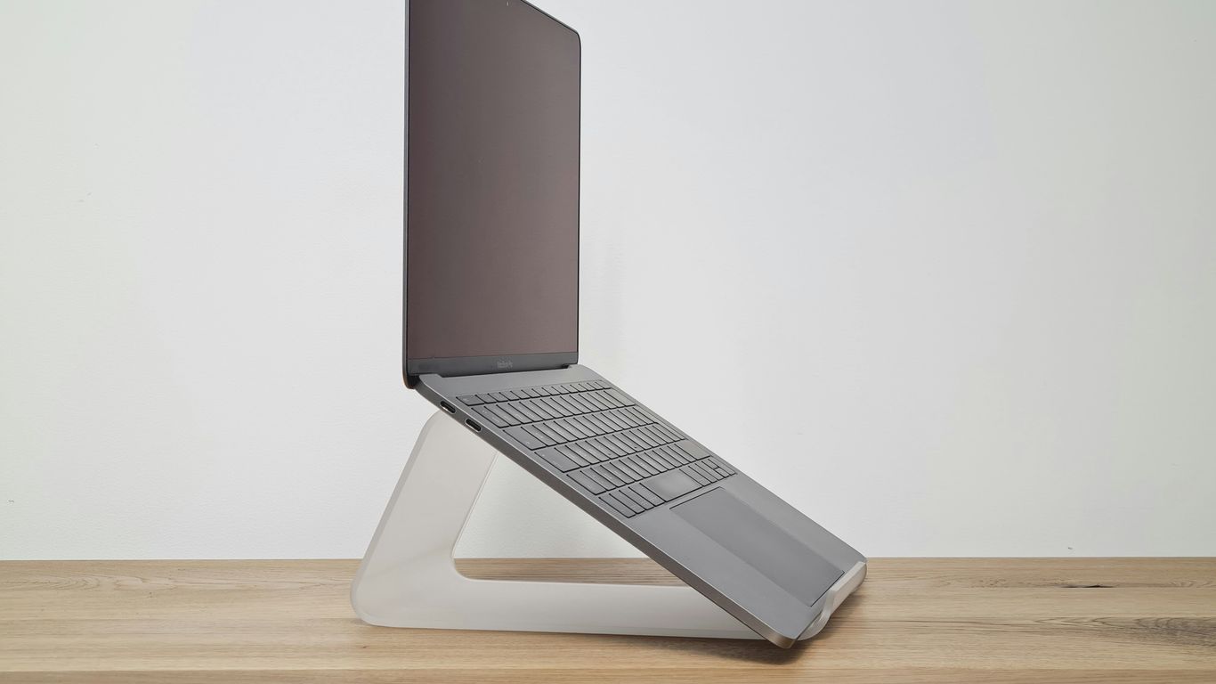 A minimalist slanted stand displaying product pricing