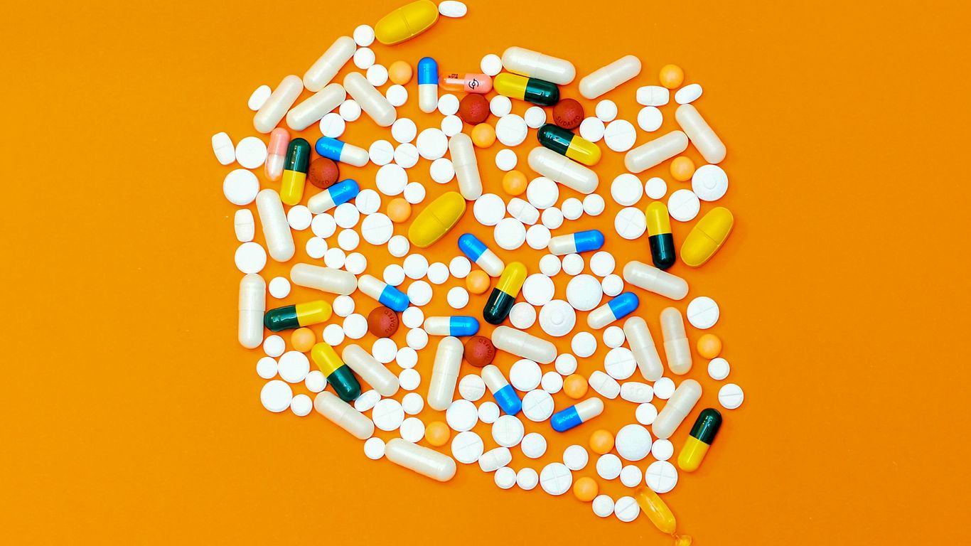 white and orange medication pill