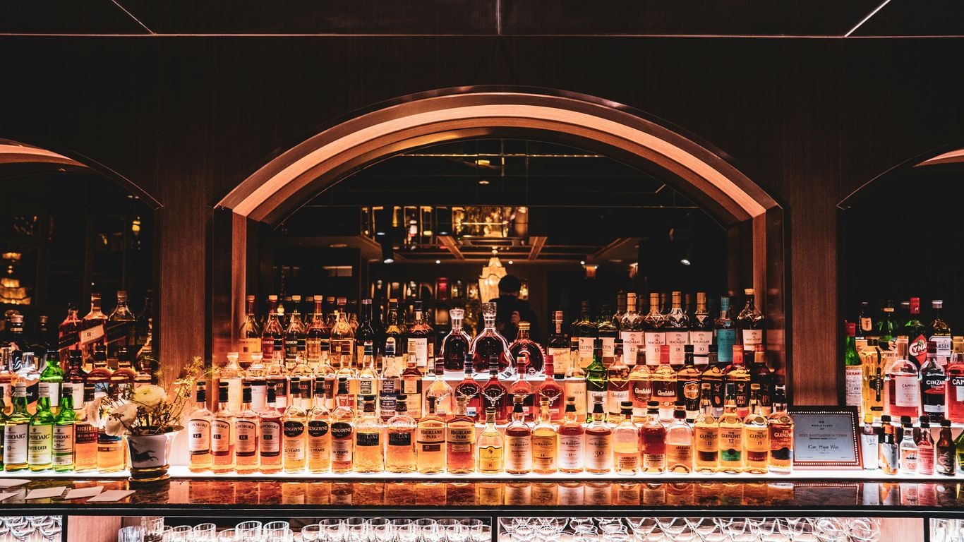 A dimly lit bar interior with wooden aesthetics