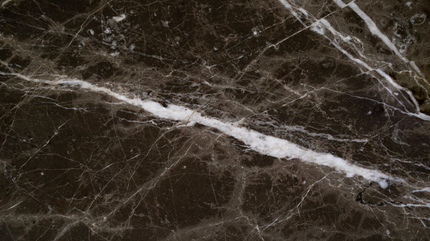 Dark marble dining table with soft daylight
