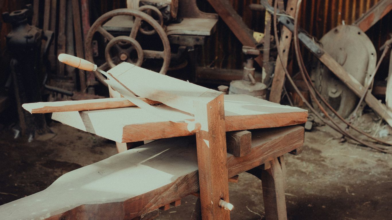 a wooden boat in a barn