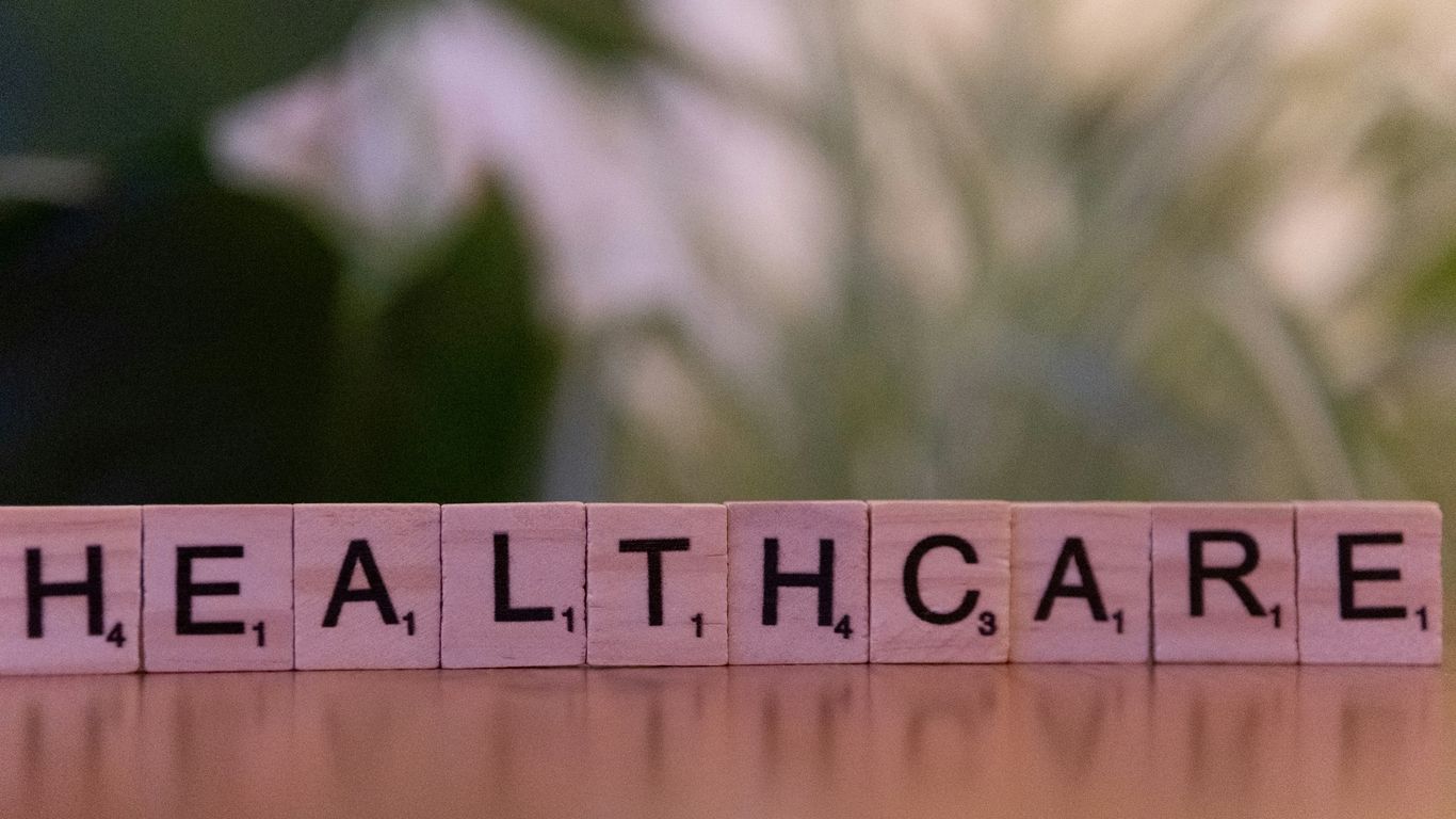 A wooden block that says healthcare on it