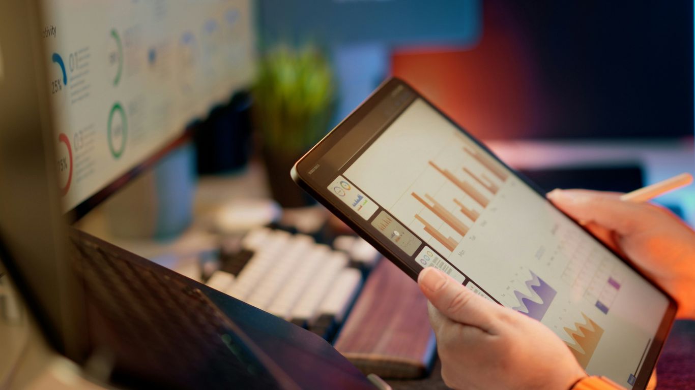 A logistics manager reviewing data on a tablet
