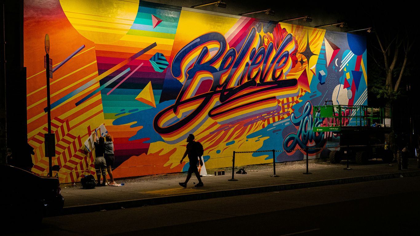 A vibrant mural painting adorning a narrow alleyway