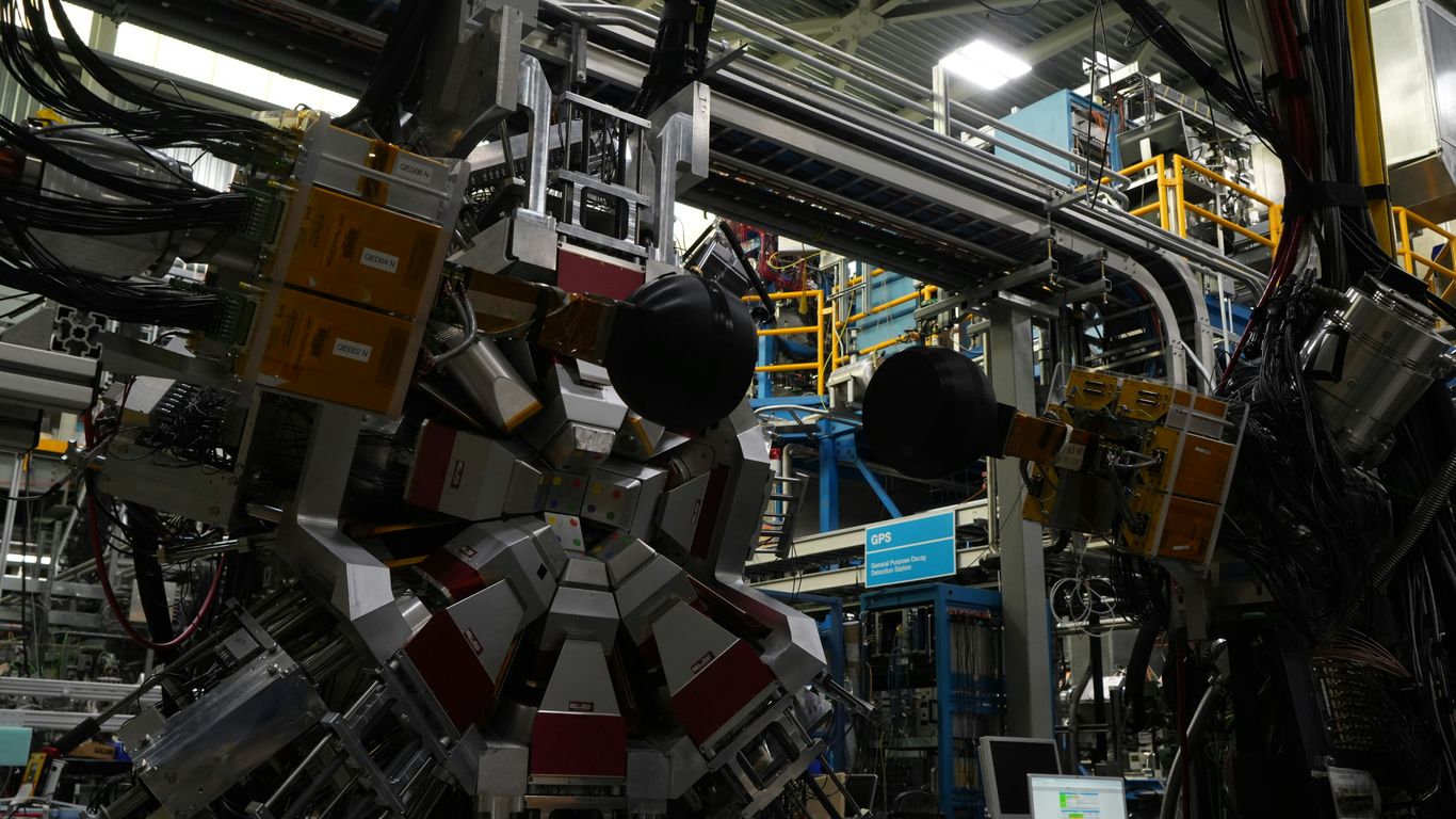 Researcher examining quantum computing hardware
