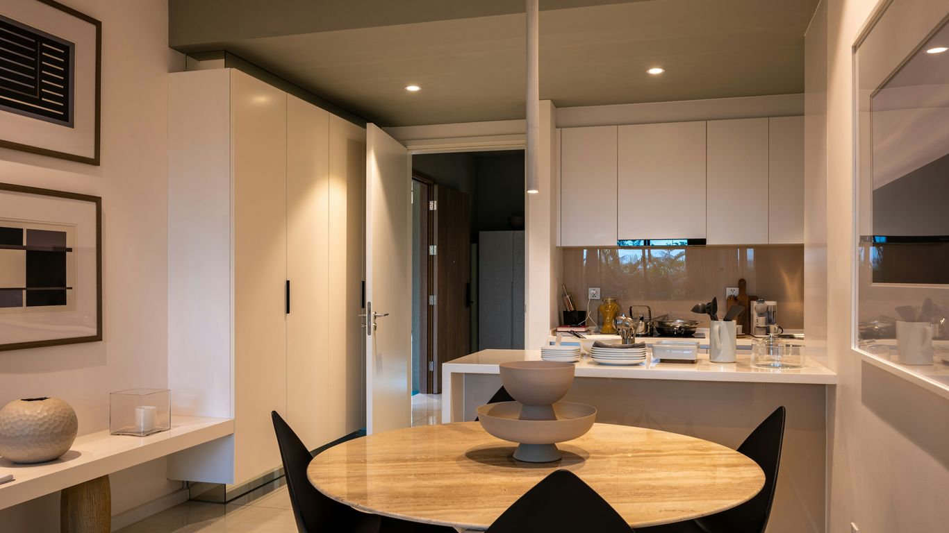 Round marble dining table in compact apartment