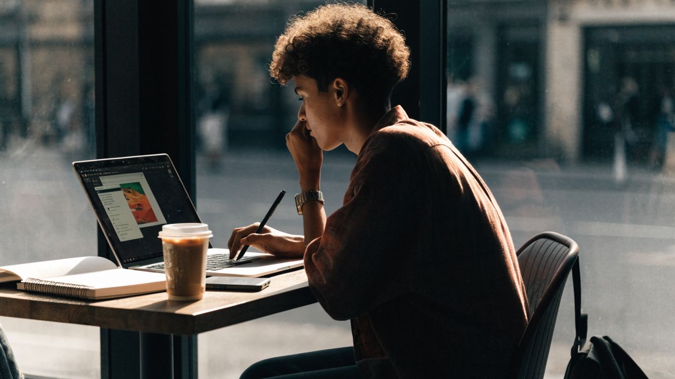 Remote job seeker reviewing openings on a laptop