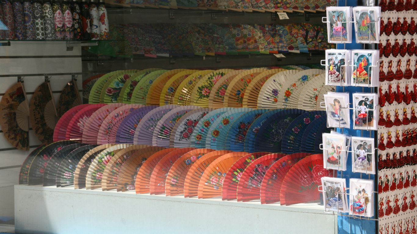 Colorful hand fans displayed in a shop.