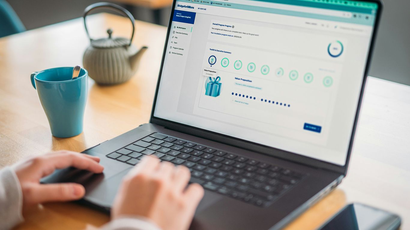 Person is using a laptop with a reward program.