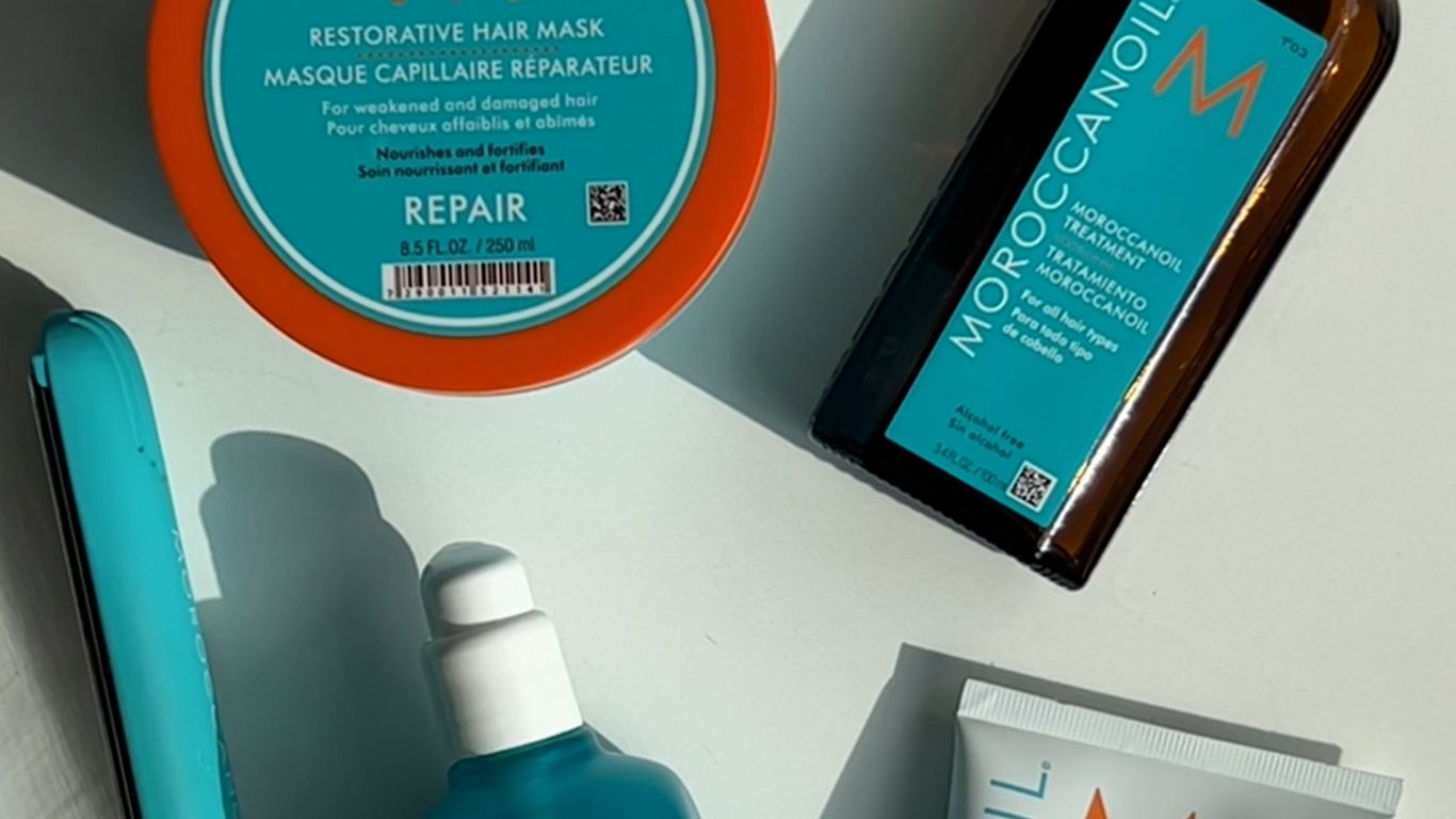 Hair care products displayed with shadows, colorful packaging, branding visible.